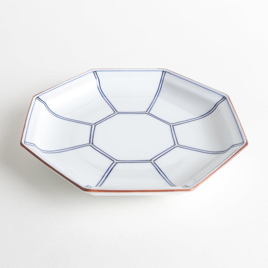 An octagonal porcelain salad plate with a minimalist grid pattern.
