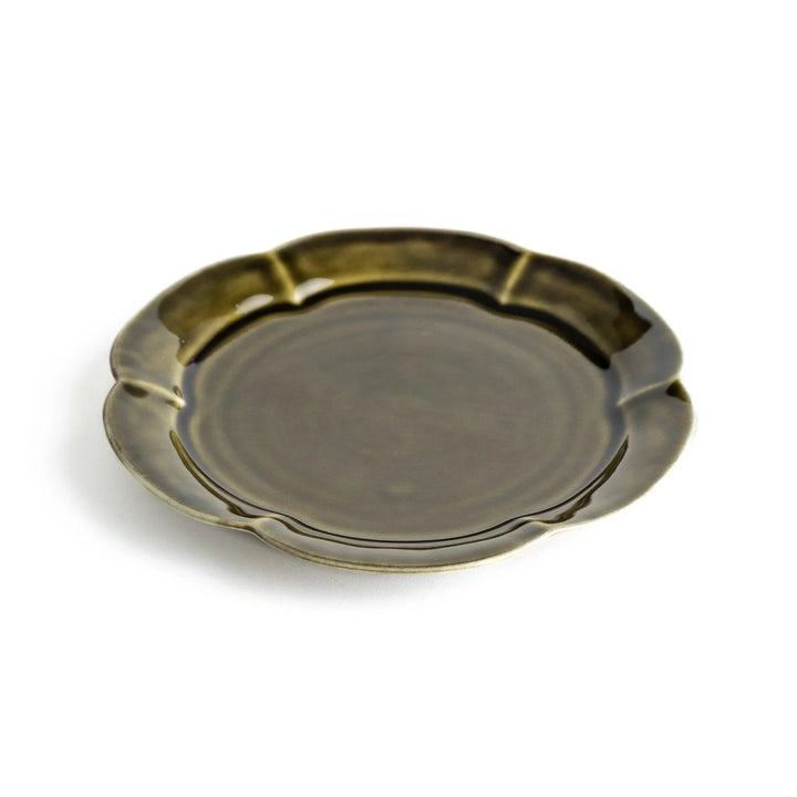 Earthy tones of olive, caramel, or off-white dessert plate, with a soft, rounded shape and subtle color variations.