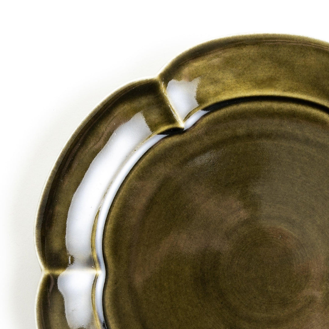 Earthy tones of olive, caramel, or off-white salad plate, with a soft, rounded shape and subtle color variations.