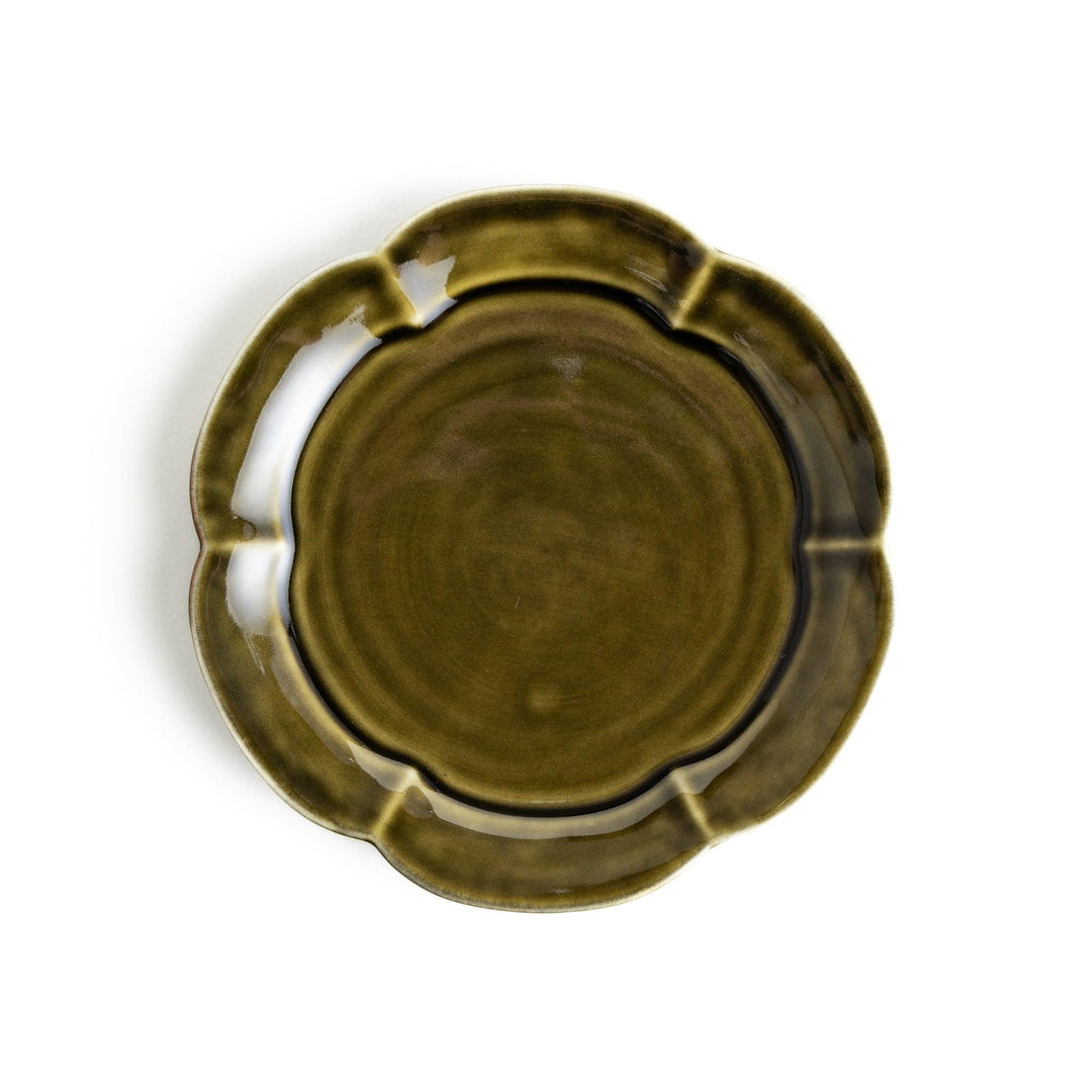 Earthy tones of olive, caramel, or off-white dessert plate, with a soft, rounded shape and subtle color variations.