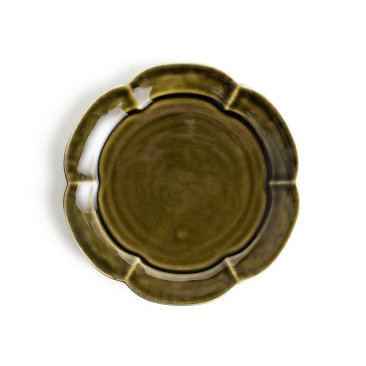 Earthy tones of olive, caramel, or off-white dessert plate, with a soft, rounded shape and subtle color variations.