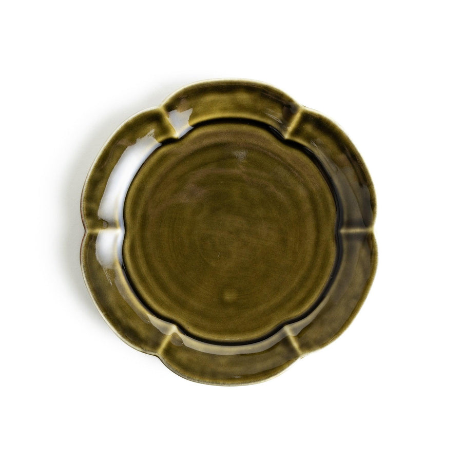 Earthy tones of olive, caramel, or off-white dessert plate, with a soft, rounded shape and subtle color variations.