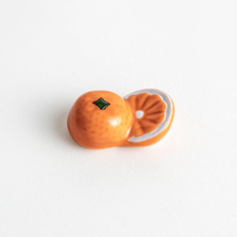 Ceramic chopstick rests shaped like half-cut orange
