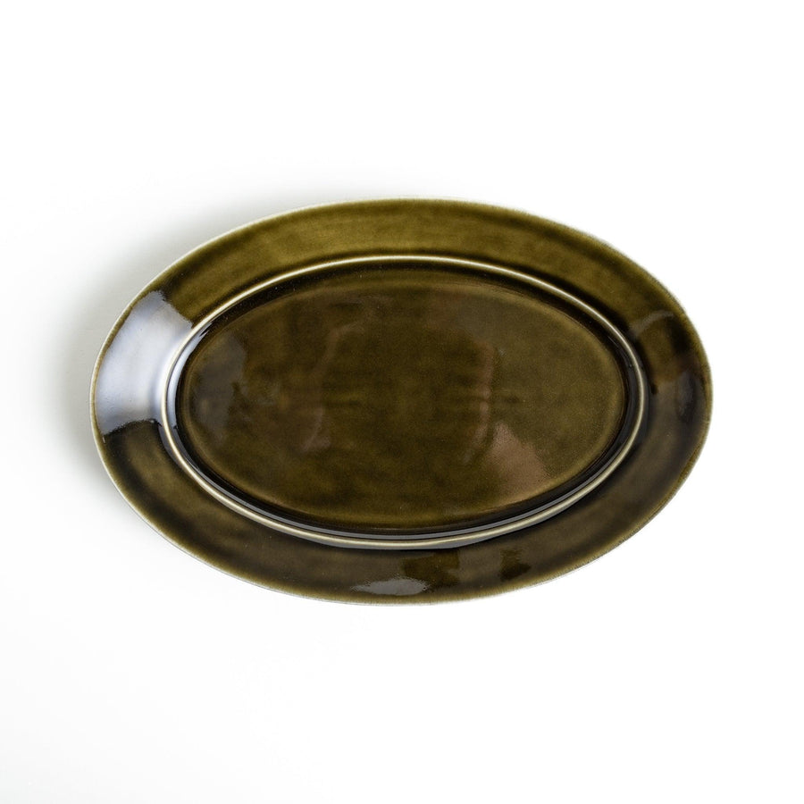 Sleek, dark brown or olive colored oval dinner plate with a glossy finish, simple and minimalist.