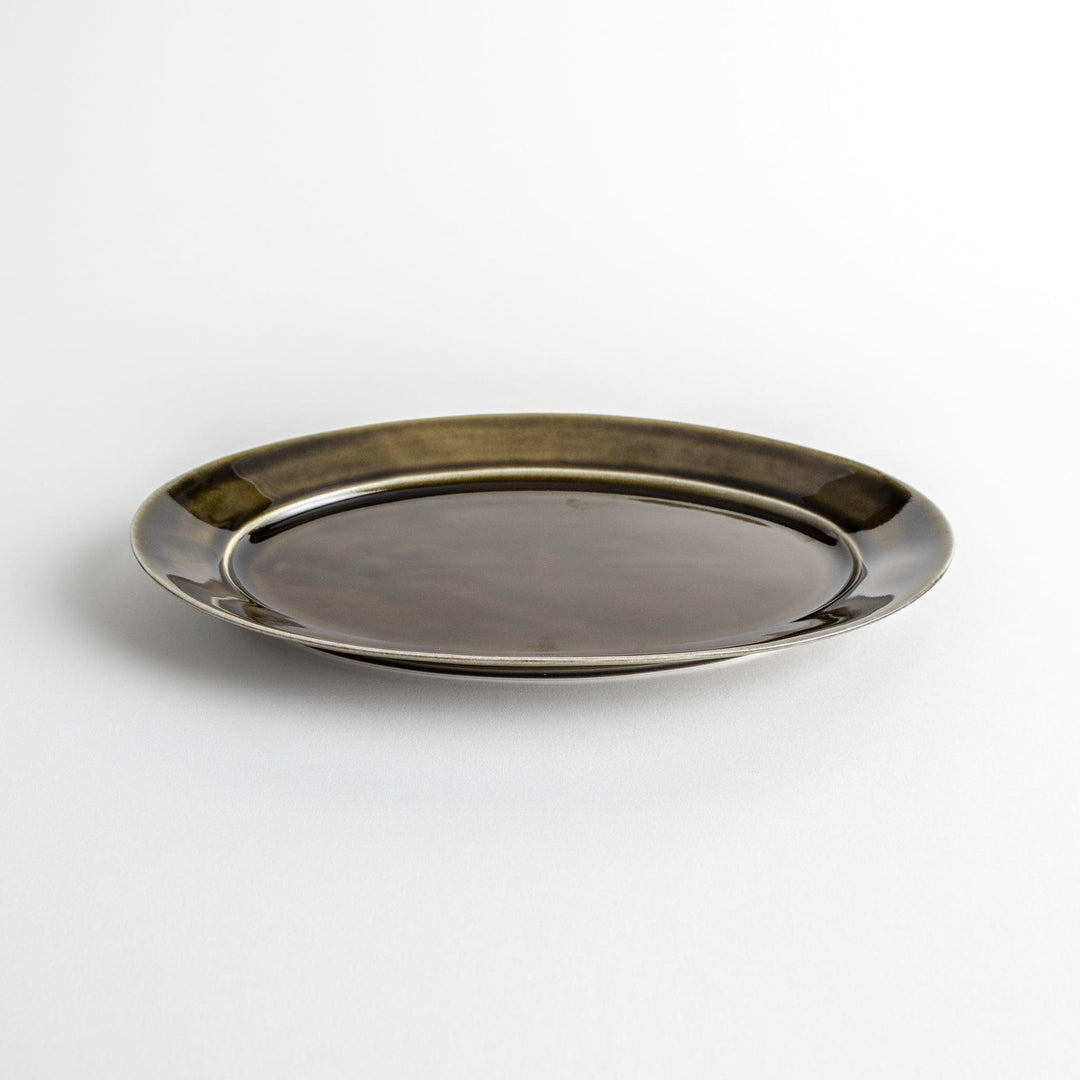 Sleek, dark brown or olive colored oval dinner plate with a glossy finish, simple and minimalist.