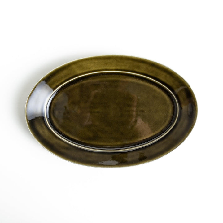 Sleek, dark brown or olive colored oval salad plate with a glossy finish, simple and minimalist.