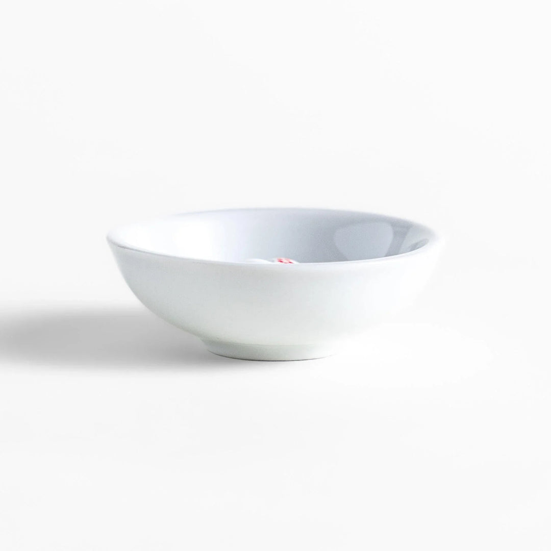 White ceramic incense holder with panda-shaped holder and floral accents adding a playful touch to home rituals.