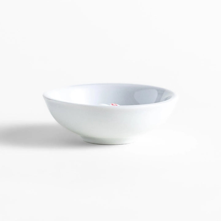 White ceramic incense holder with panda-shaped holder and floral accents adding a playful touch to home rituals.