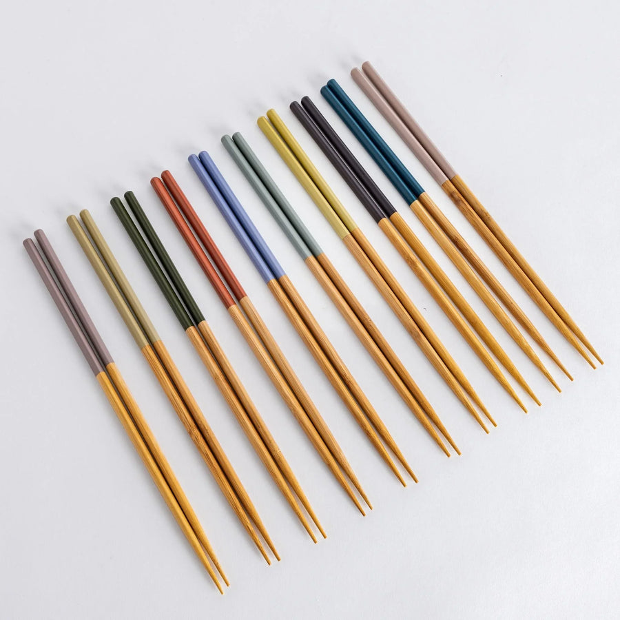 Cooking chopsticks with pastel-colored tips and bamboo shafts. A vibrant collection for various cooking purposes.