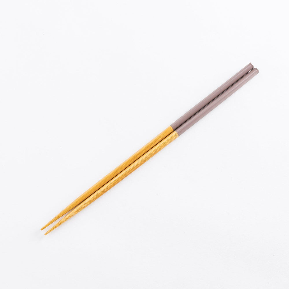 Cooking chopsticks with pastel-colored tips in rosybrown and bamboo shafts, perfect for a variety of cooking tasks.