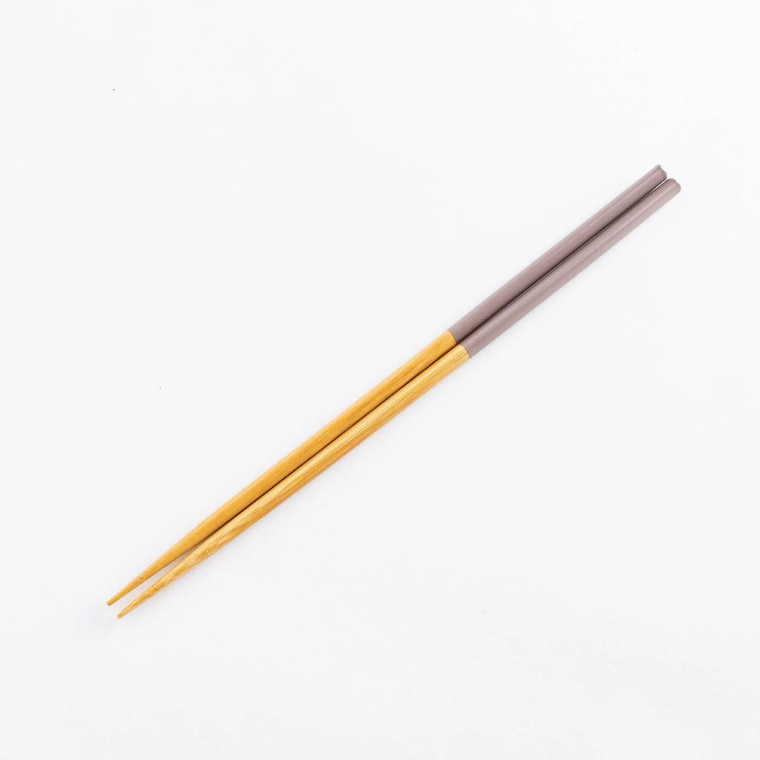 Cooking chopsticks with pastel-colored tips in rosybrown and bamboo shafts, perfect for a variety of cooking tasks.