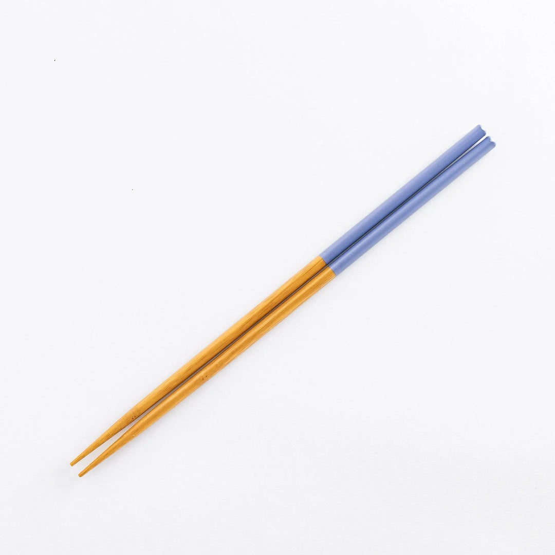 Bamboo cooking chopsticks with soft blue tips for a stylish touch in your kitchen.