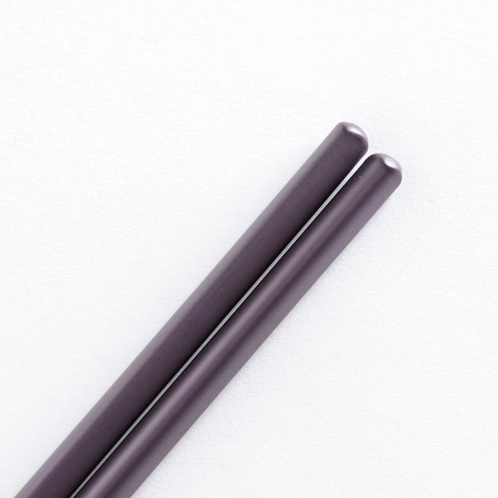 Close-up of darkslateblue tips of cooking chopsticks.