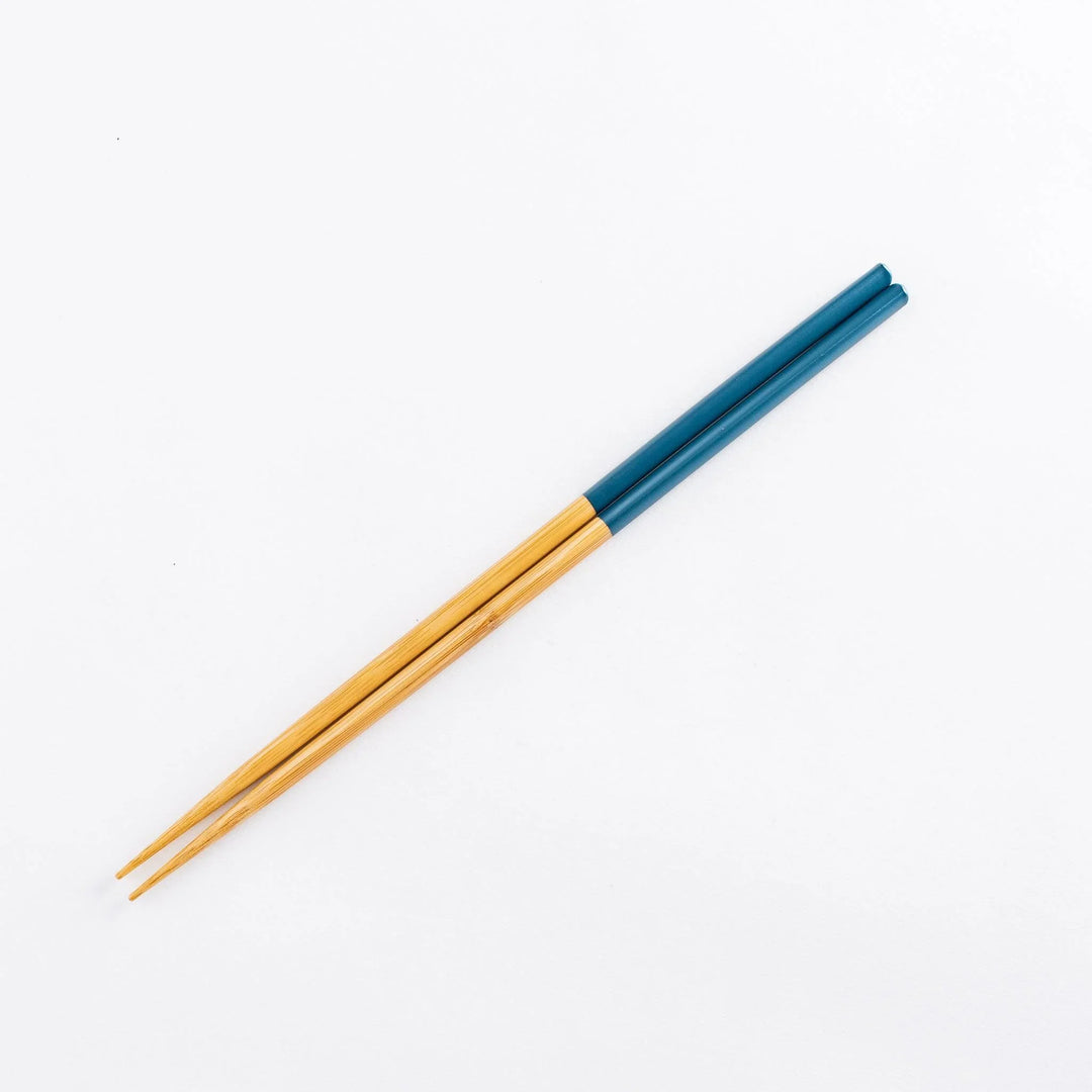 Chopsticks with teal-colored tips and bamboo body.