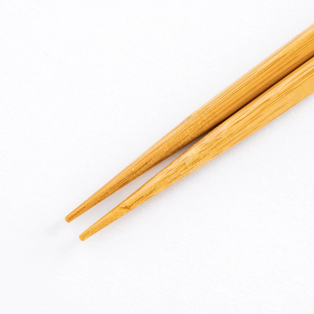 Close-up of bamboo ends of chopsticks.
