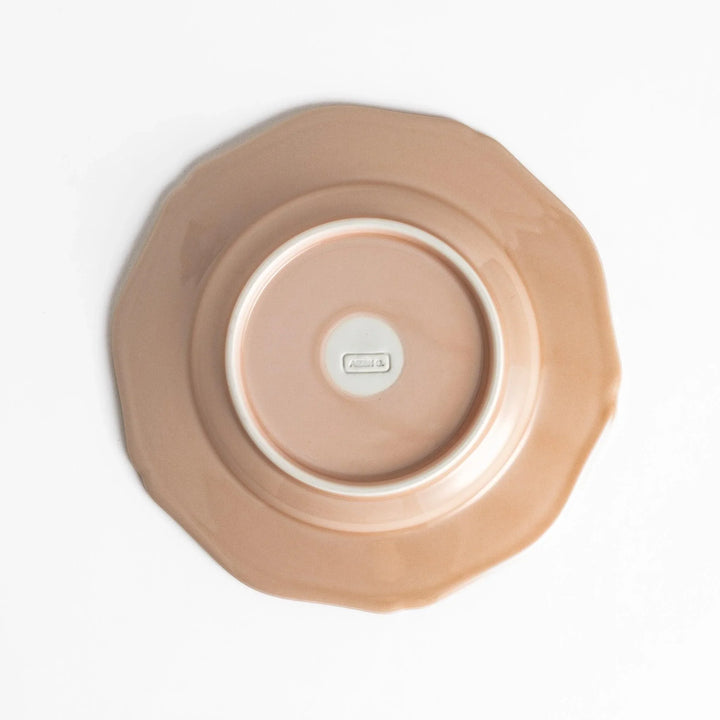 Pretty pink dessert plate with a delicate scalloped edge, ideal for showcasing your favorite treats.