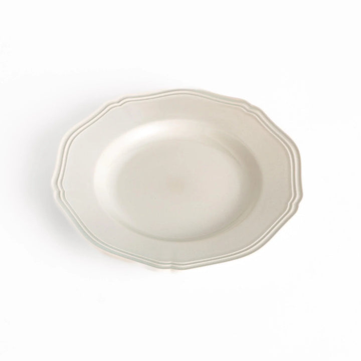 Pretty white dessert plate with a delicate scalloped edge, ideal for showcasing your favorite treats.