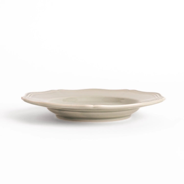 Pretty gray dessert plate with a delicate scalloped edge, ideal for showcasing your favorite treats.