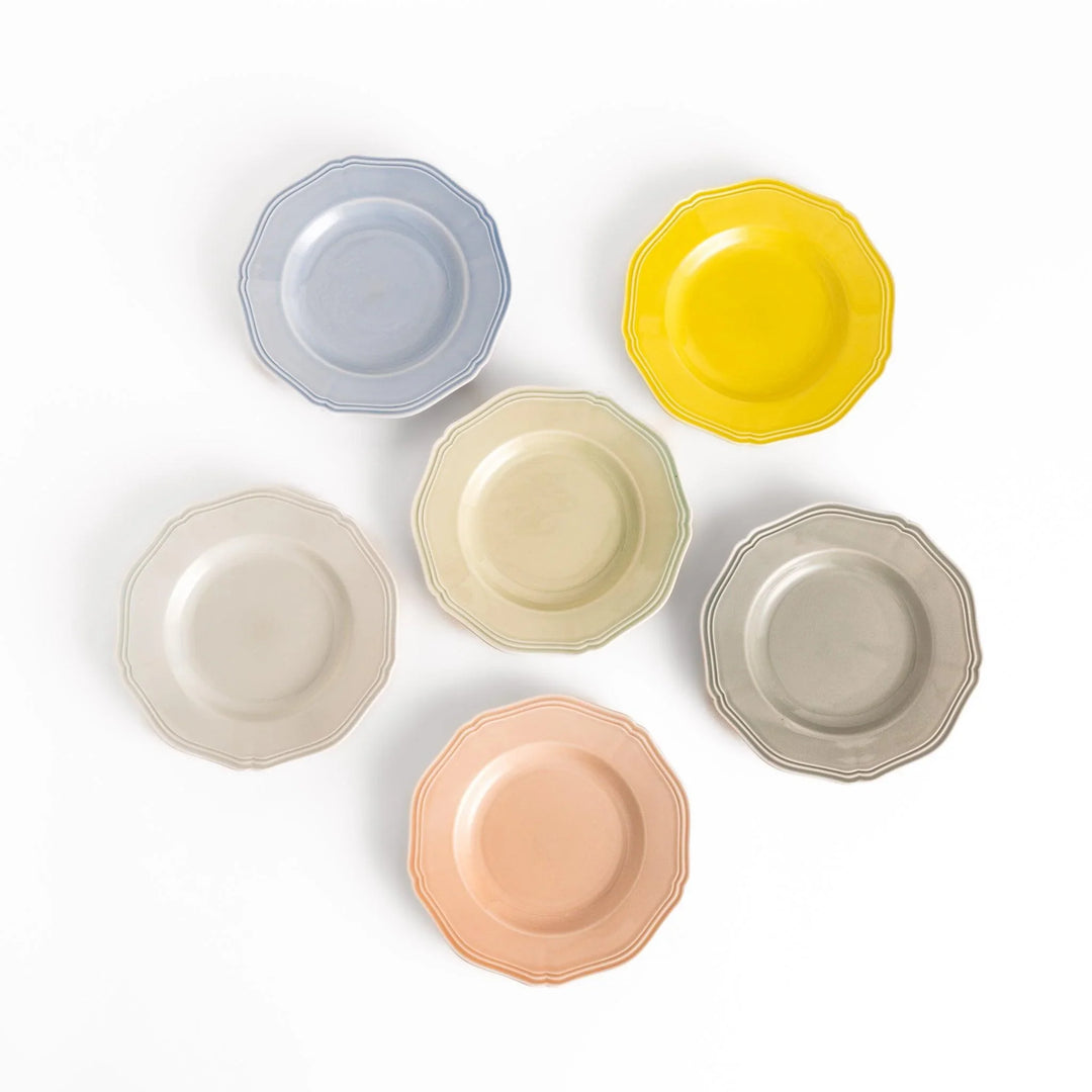 Six pastel Japanese dessert plates in pink blue yellow green white and gray with elegant scalloped edge.