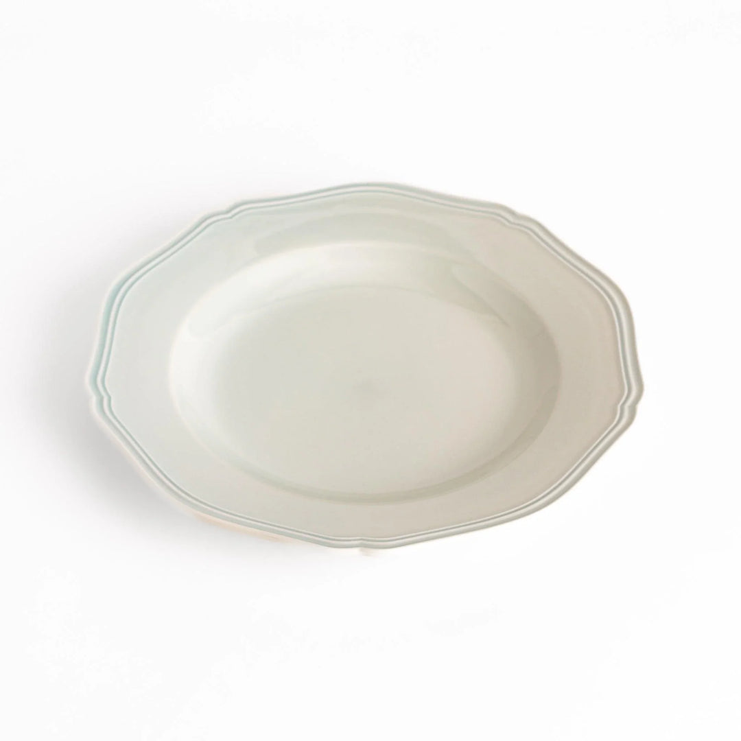 Pretty white dinner plate with a delicate scalloped edge, ideal for showcasing your culinary creations.