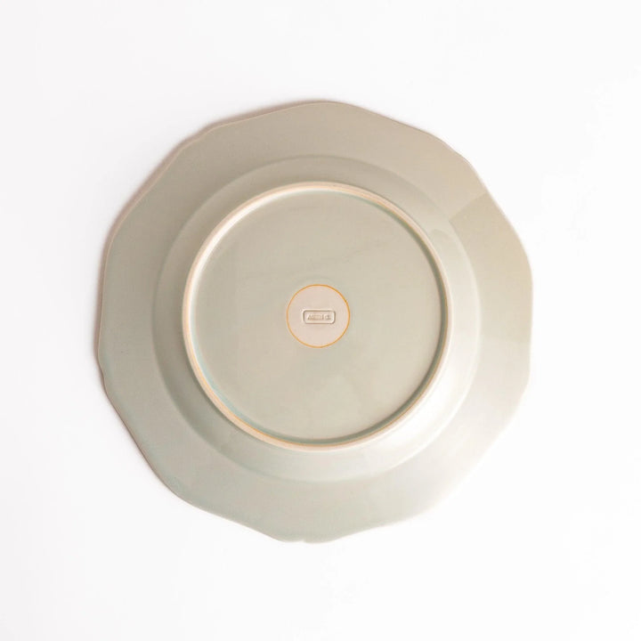 Pretty white dinner plate with a delicate scalloped edge, ideal for showcasing your culinary creations.