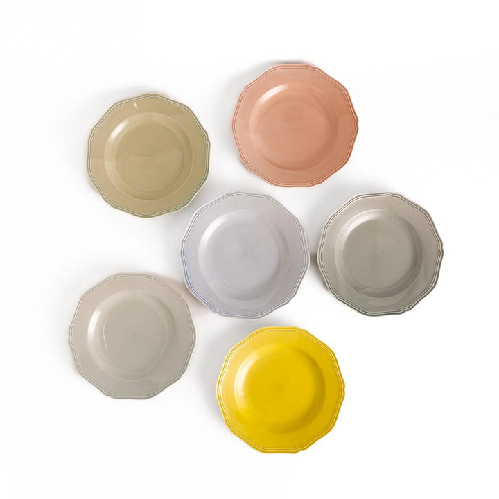 Six pastel Japanese dinner plates in pink blue yellow green white and gray with elegant scalloped edge.