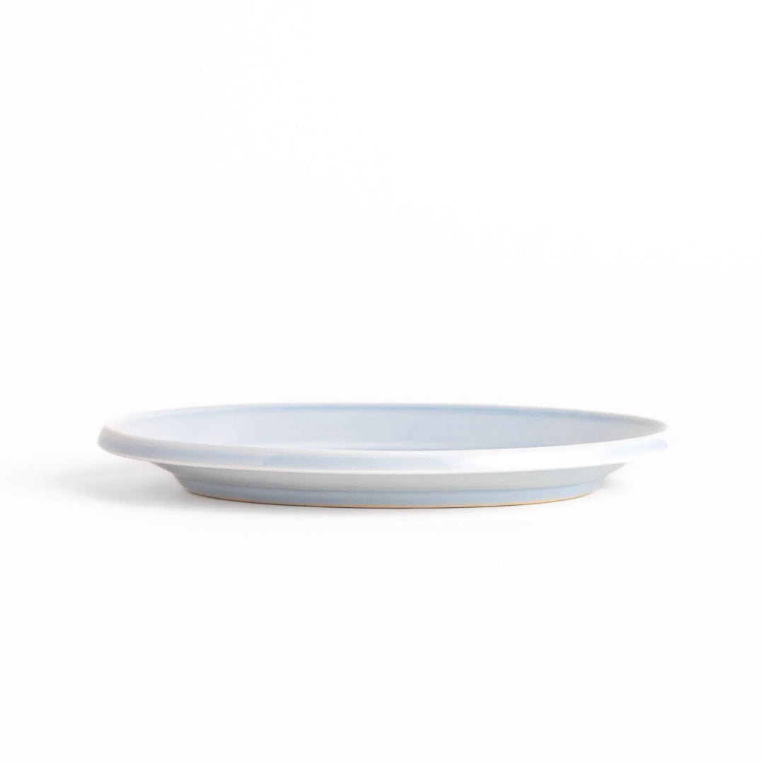 Durable and elegant blue ceramic dessert plate, adding a pop of sunshine to your table setting.
