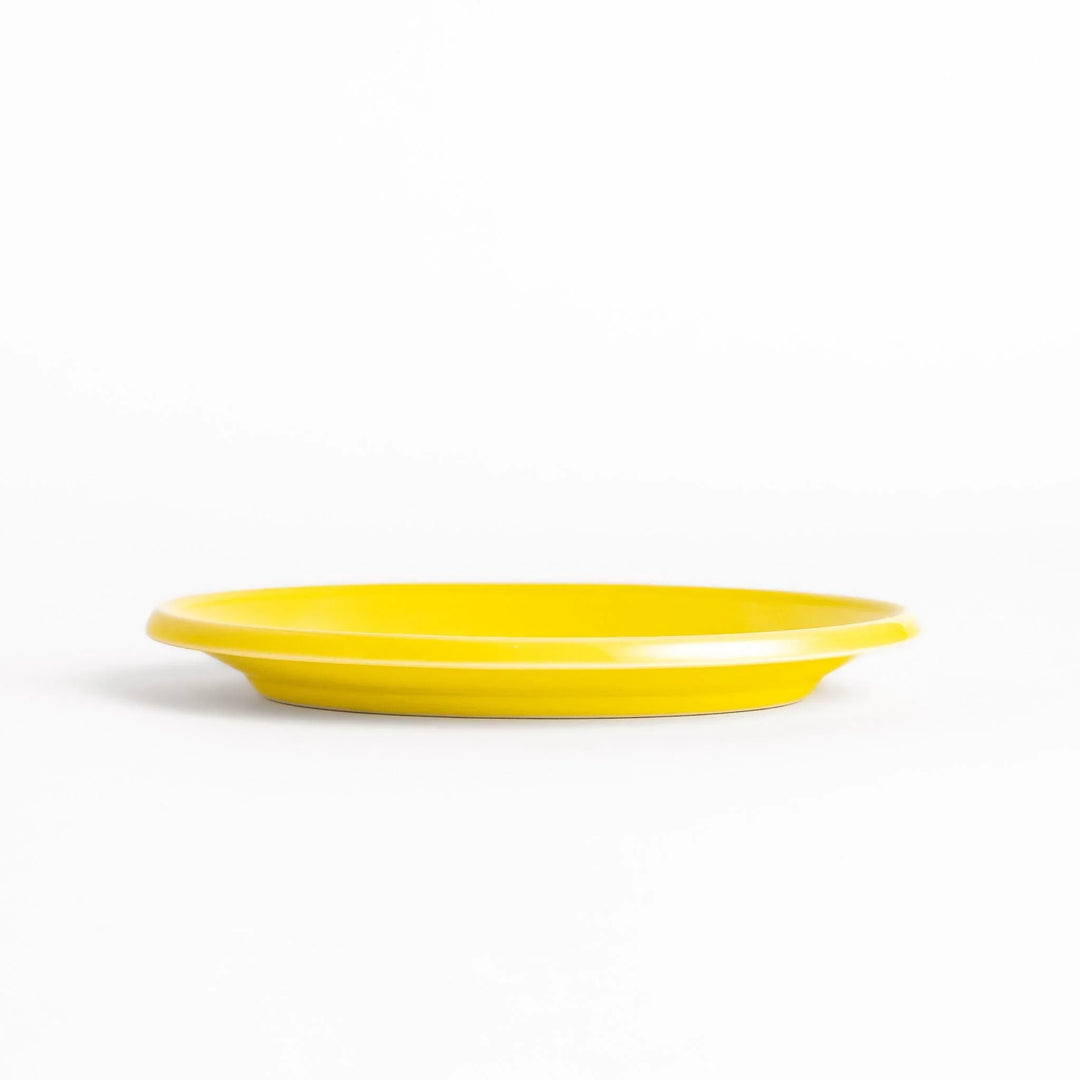 Durable and elegant yellow ceramic dessert plate, adding a pop of sunshine to your table setting.