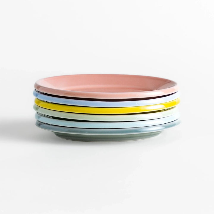 Stack of Japanese oval dessert plates in soft pastel colors, crafted with a smooth glossy finish for everyday elegance