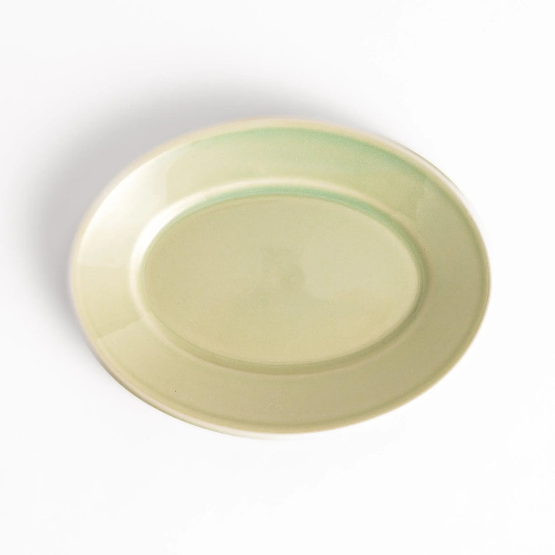 Durable and elegant green ceramic dessert plate, adding a pop of sunshine to your table setting.