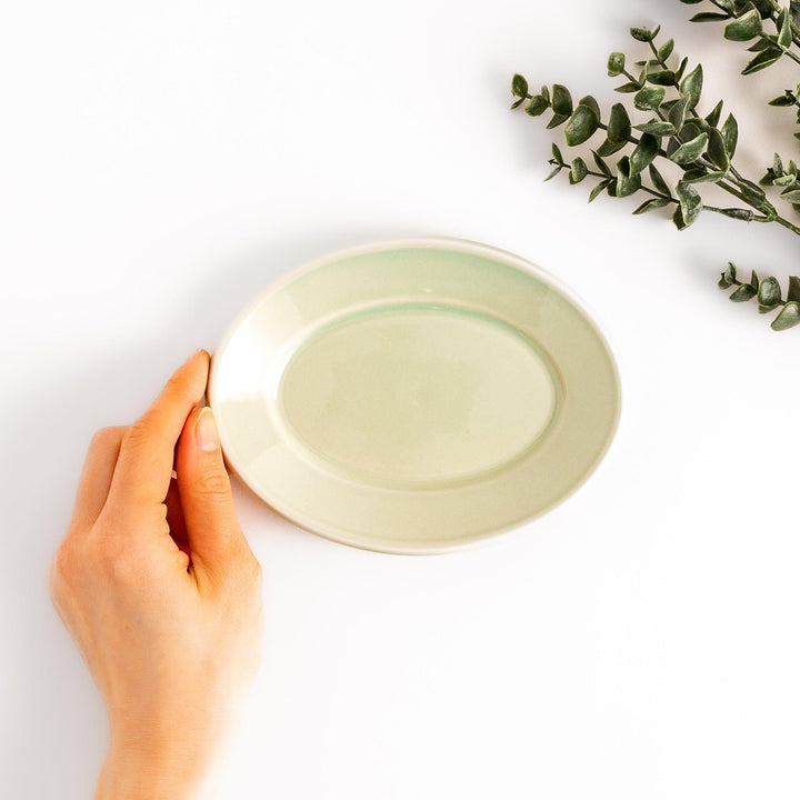 Durable and elegant green ceramic dessert plate, adding a pop of sunshine to your table setting.