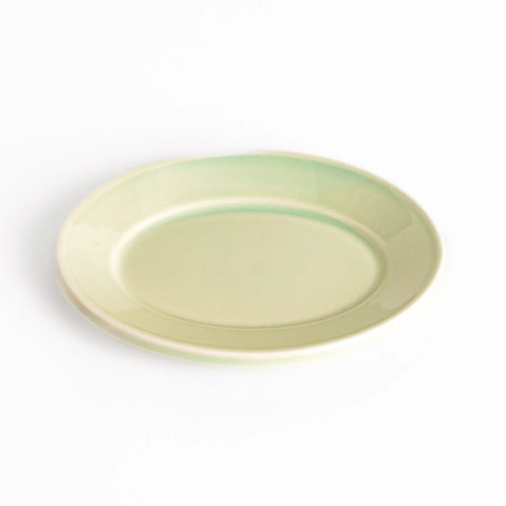 Durable and elegant green ceramic dessert plate, adding a pop of sunshine to your table setting.