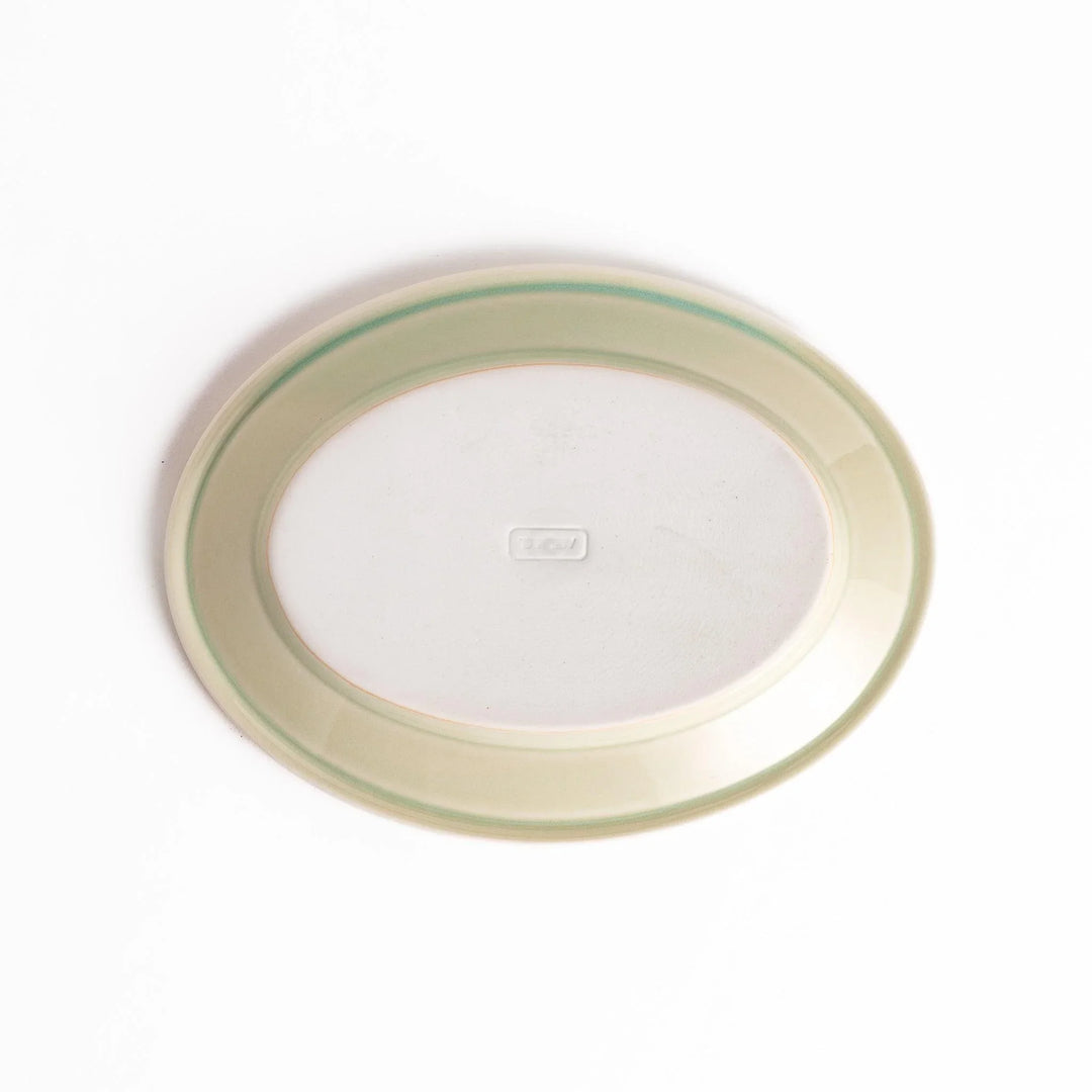 Durable and elegant green ceramic dessert plate, adding a pop of sunshine to your table setting.