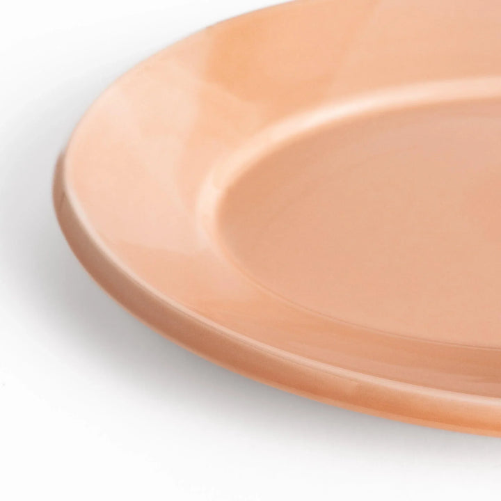Durable and elegant pink ceramic dinner plate, adding a pop of color to your table setting.
