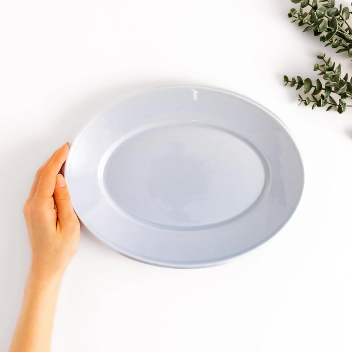 Durable and elegant blue ceramic dinner plate, adding a pop of color to your table setting.