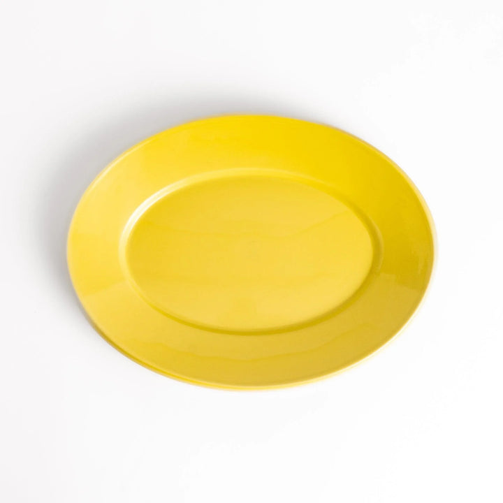 Durable and elegant yellow ceramic dinner plate, adding a pop of color to your table setting.