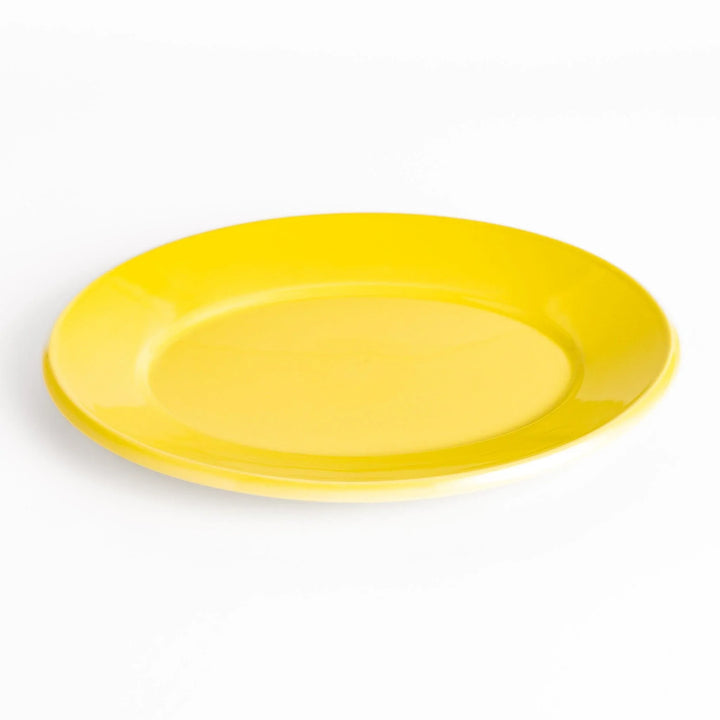 Durable and elegant yellow ceramic dinner plate, adding a pop of color to your table setting.