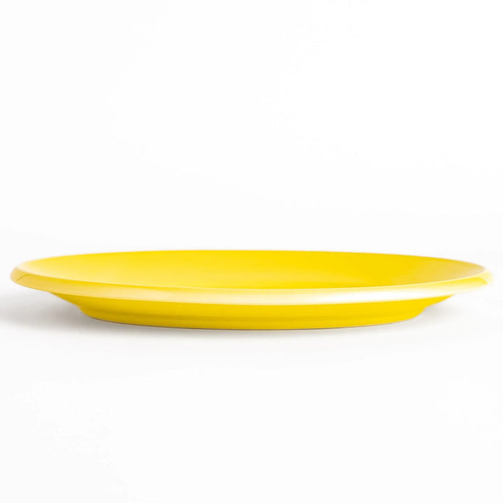 Durable and elegant yellow ceramic dinner plate, adding a pop of color to your table setting.