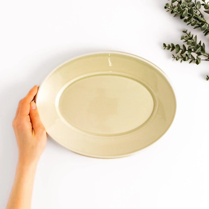 Durable and elegant green ceramic dinner plate, adding a pop of color to your table setting.
