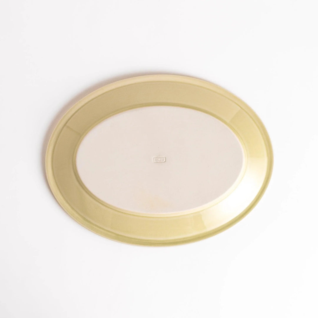 Durable and elegant green ceramic dinner plate, adding a pop of color to your table setting.