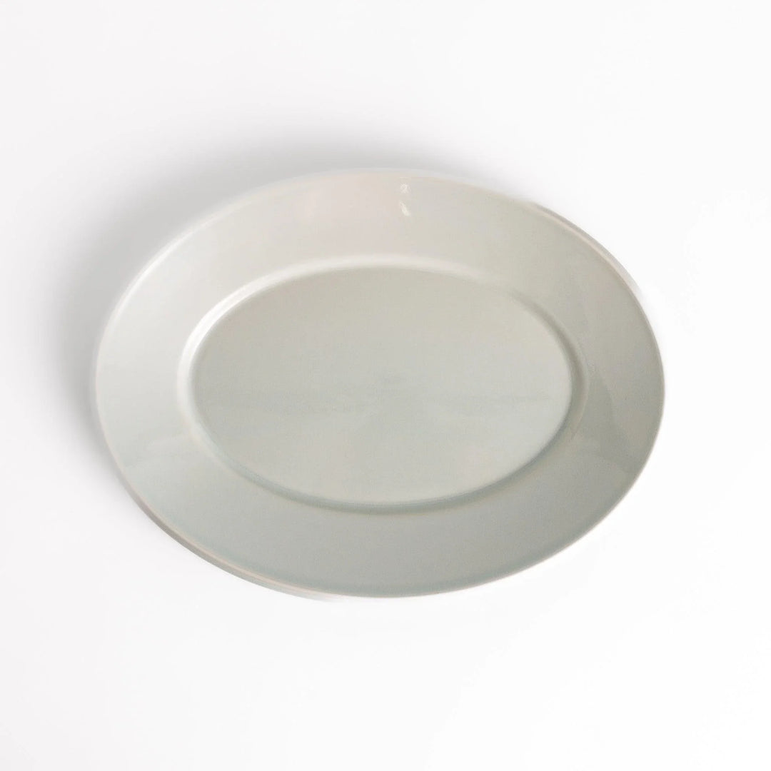 Durable and elegant white ceramic dinner plate, adding a pop of color to your table setting.