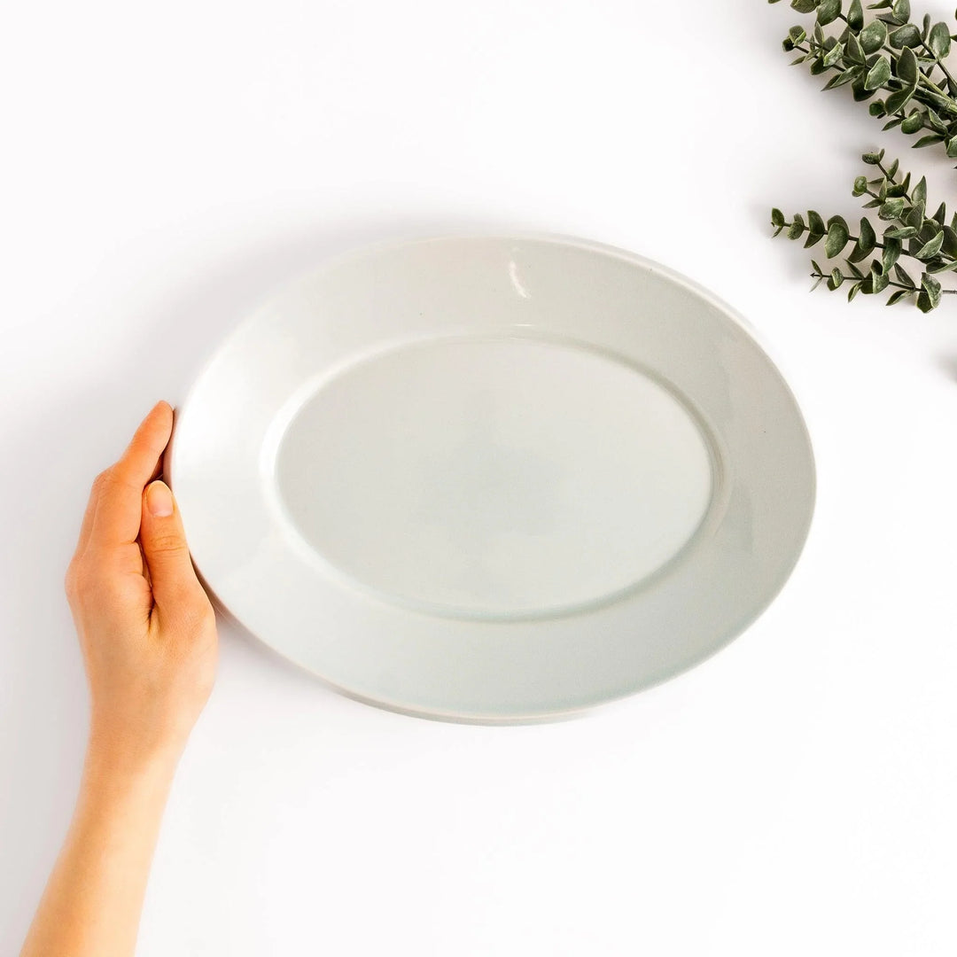 Durable and elegant white ceramic dinner plate, adding a pop of color to your table setting.
