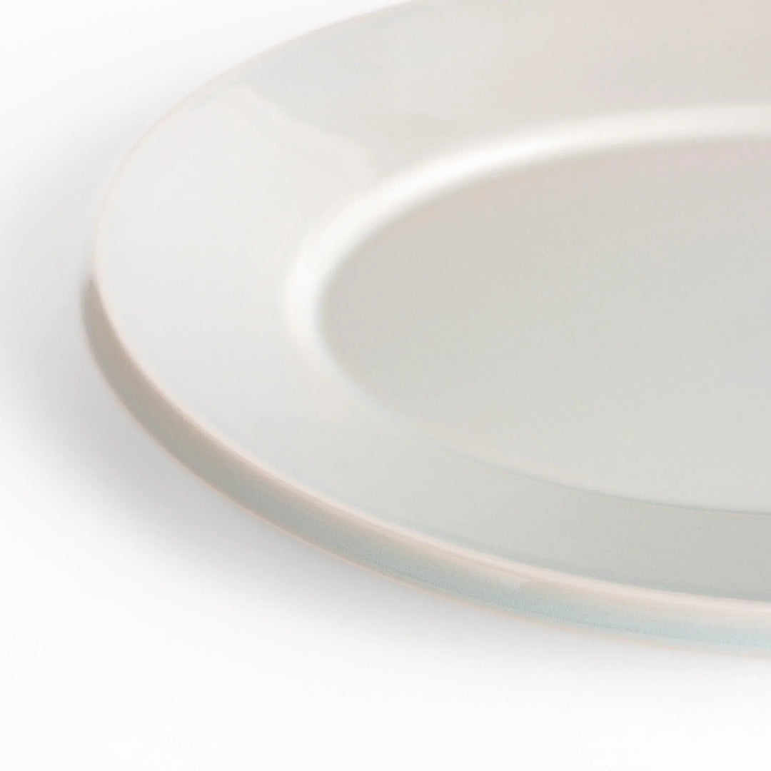 Durable and elegant white ceramic dinner plate, adding a pop of color to your table setting.