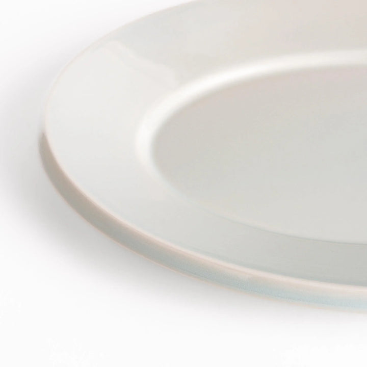 Durable and elegant white ceramic dinner plate, adding a pop of color to your table setting.