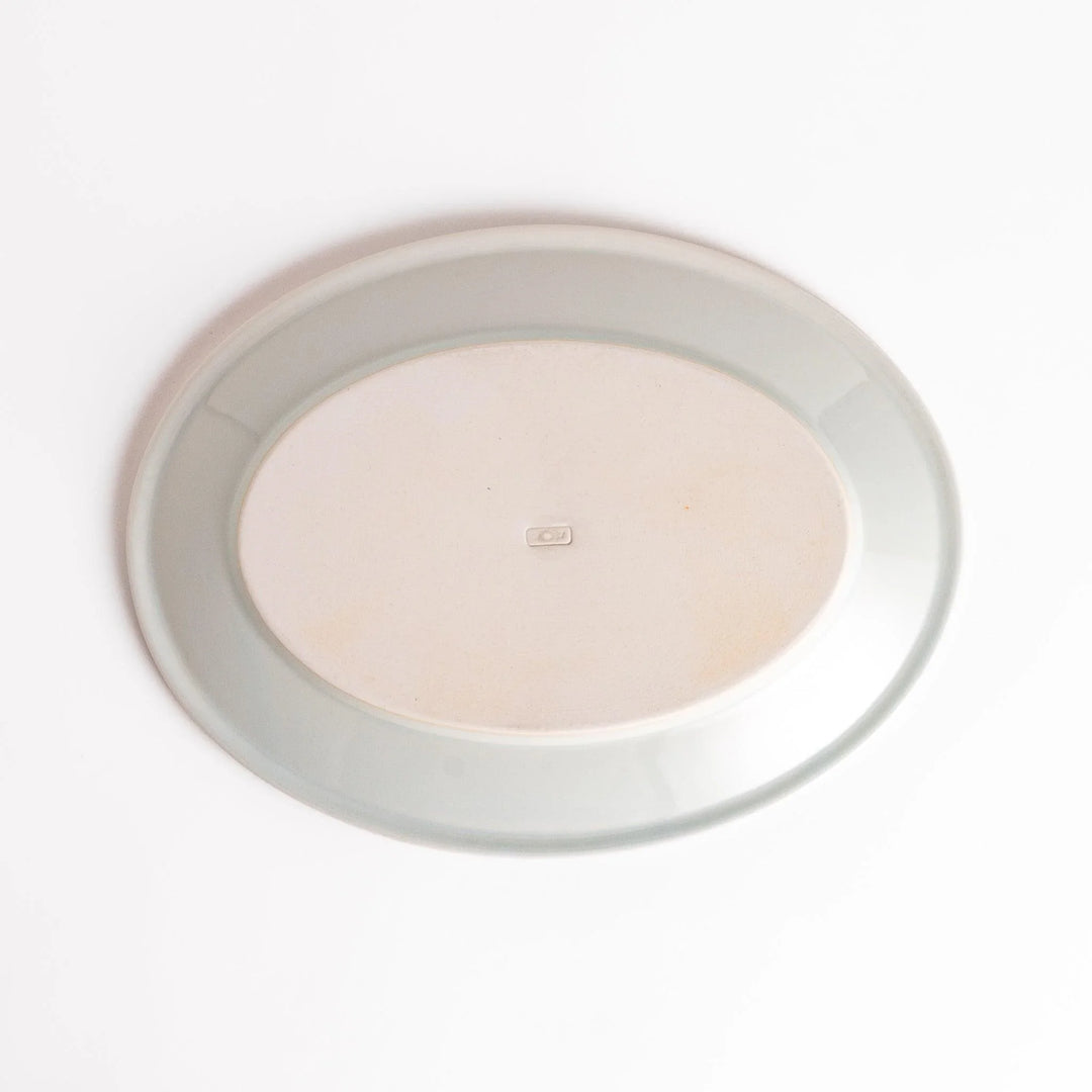 Durable and elegant white ceramic dinner plate, adding a pop of color to your table setting.