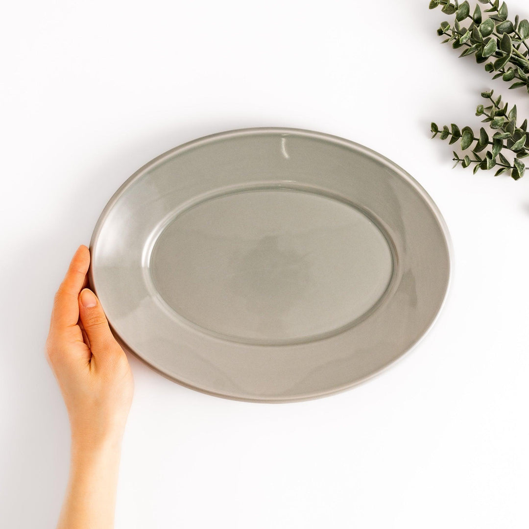 Durable and elegant gray ceramic dinner plate, adding a pop of color to your table setting.