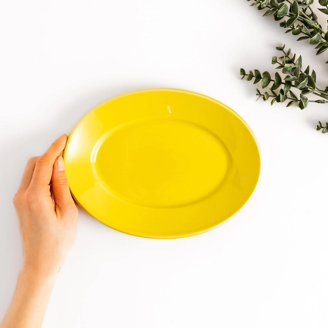 Durable and elegant yellow ceramic salad plate, adding a pop of color to your table setting.