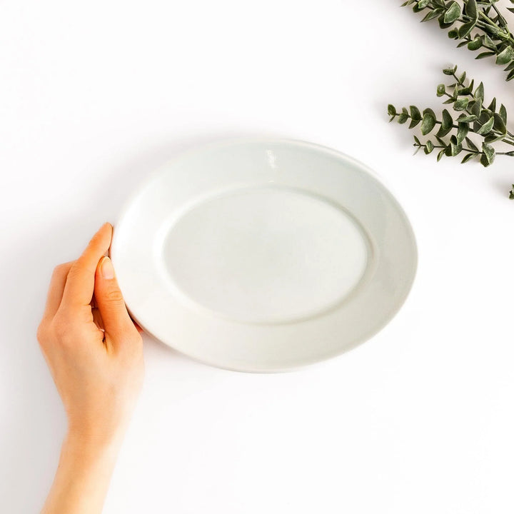 Durable and elegant white ceramic salad plate, adding a pop of color to your table setting.