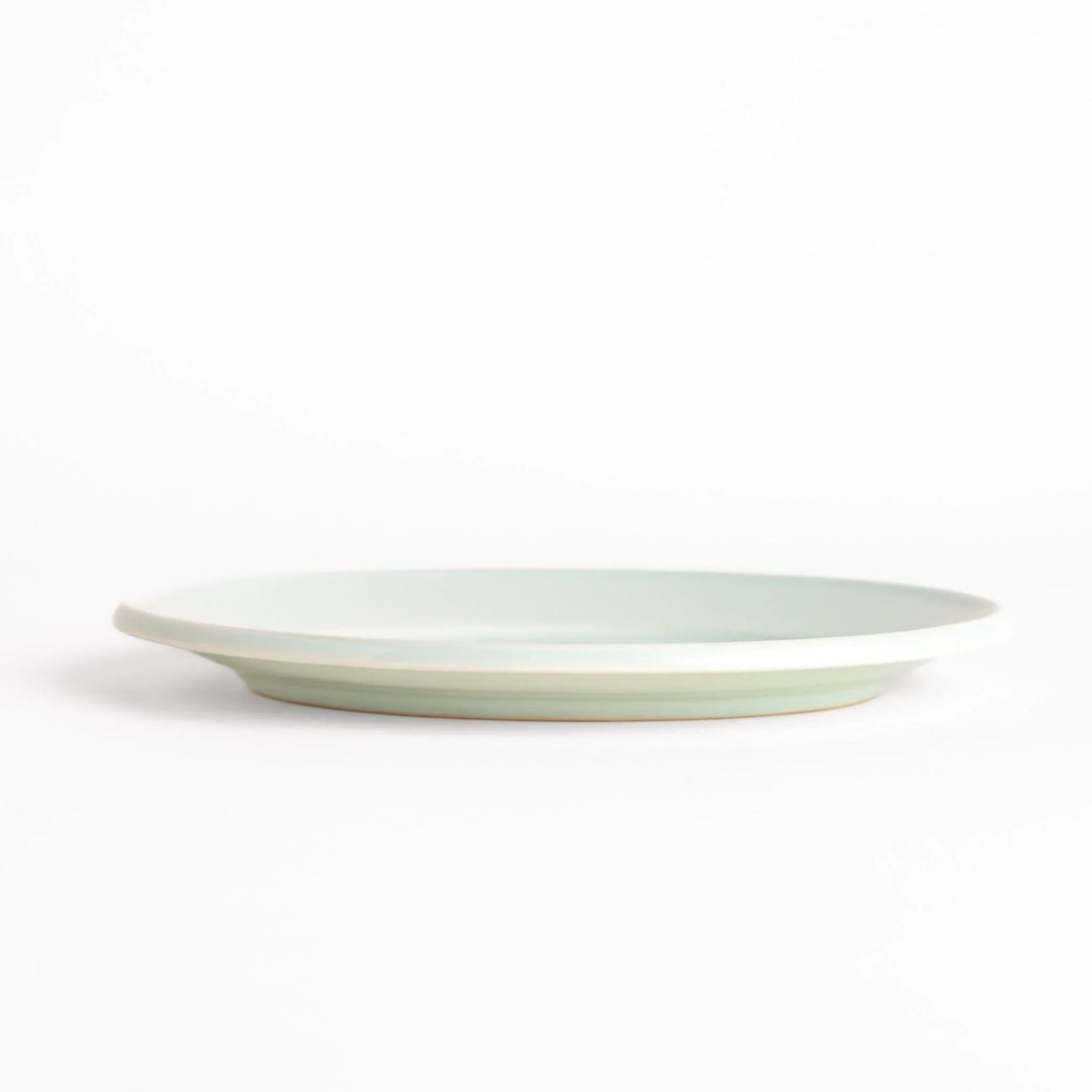 Durable and elegant white ceramic salad plate, adding a pop of color to your table setting.