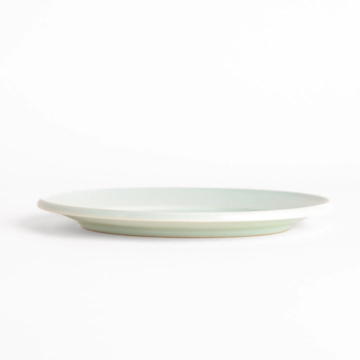 Durable and elegant white ceramic salad plate, adding a pop of color to your table setting.